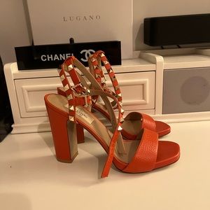 Orange studded double strap Valentino heels